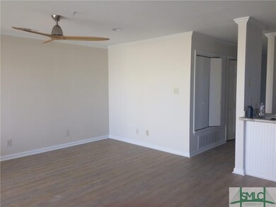 Living room with new modern fan.  New floor coveri