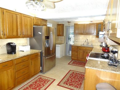 Eat in kitchen with loads of cabinets and counter space