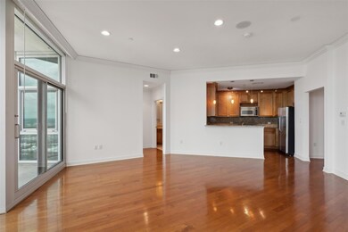 Unfurnished living room featuring ornamental moldi
