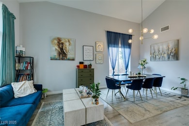 Dining room featuring arched walkways, stairs, hig