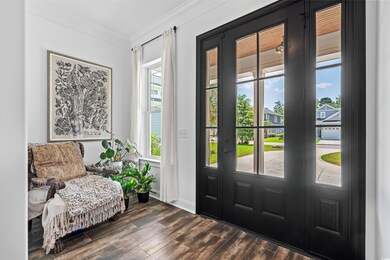 Foyer featuring dark wood-type flooring and orname