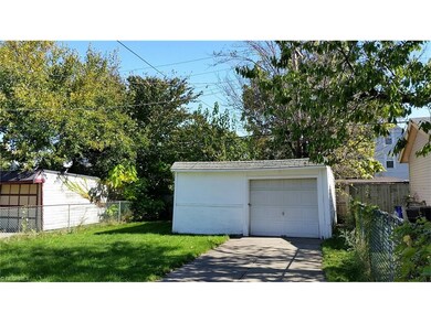 Backyard is fenced with one and a half car garage.