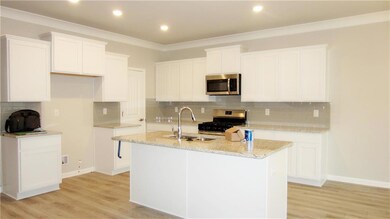 Kitchen Area with Granit Counter Tops and Stainles