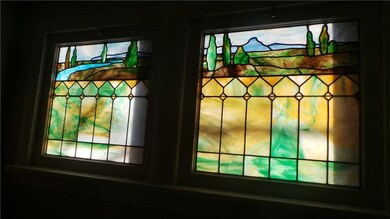 Stained glass windows on the landing add character