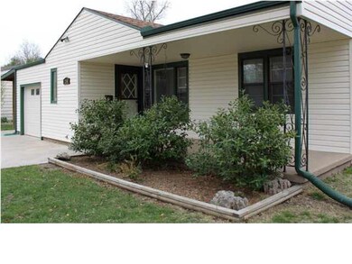 ENJOY THE WARM GREETING THIS COVERED PORCH PRESENT
