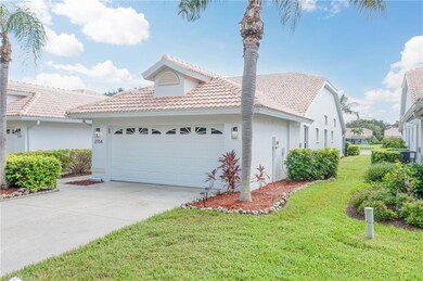 View of home's exterior with a yard, a tile roof, 