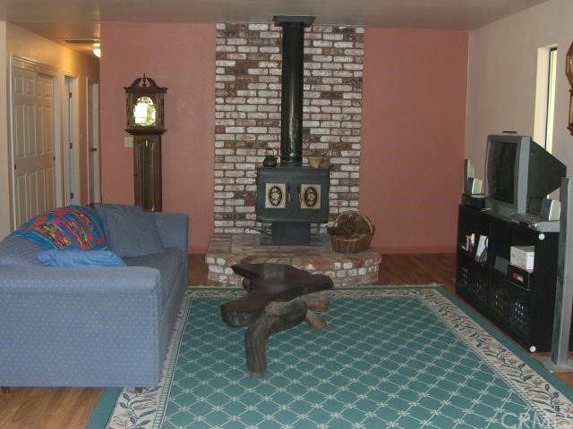 Living room with raised hearth and wood burning st