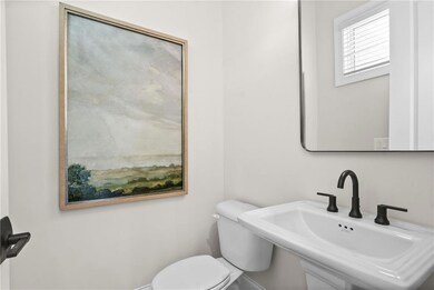 Powder Room tucked away on main level living *Home is Under Construction. Photos shown are from other TPG Communities to display how the home will live*