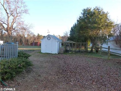 Exterior Back - Storage building in back of home