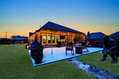 What a lovely view at twilight, as your daytime outdoor festivities slow down. Note that privacy fencing surrounds the entire rear property (part of a generous 14,320 square-foot cul-de-sac lot) for added security and comfortable gatherings. (Don't mind the 'visitor' right. He's harmless, but very protective.)