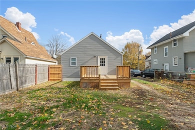 Rear view of house with a wooden deck