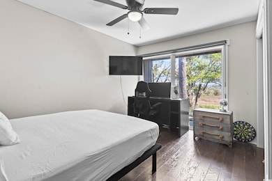 Bedroom featuring vaulted ceiling, hardwood / wood