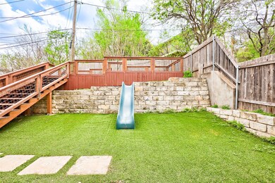 View of yard featuring stairway and a wooden deck