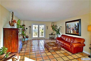 Living room opens to front yard with French doors