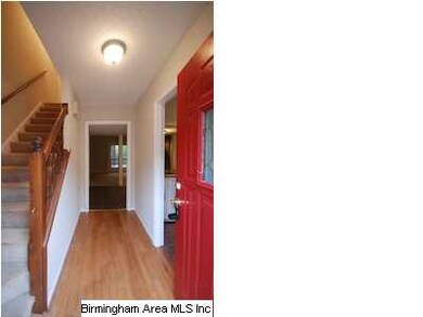 Entryway with Laminate Hardwood Floors.
