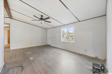 Spare room with ceiling fan and wood finished floors
