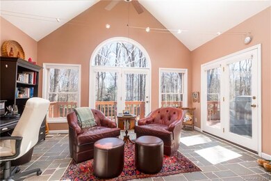 Sunroom with two sets of french doors, which acces