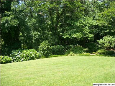 Pretty landscaped back yard with sprinkler system 