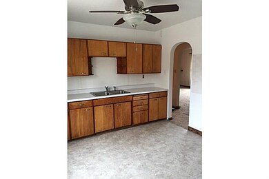 Kitchen. More archways in this eat in kitchen