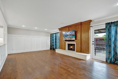 Unfurnished living room featuring a decorative wa