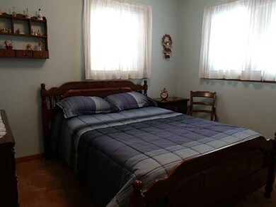 Bedroom. Bedroom with closet and hardwood flooring