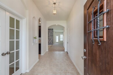 Large extended foyer high ceilings and wall niches.