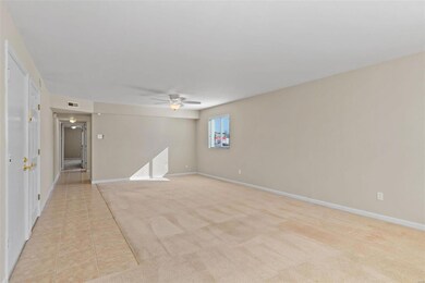 Another view of Bright Living Room and Dining Room