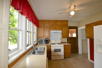 The kitchen boasts ample storage & counter space.