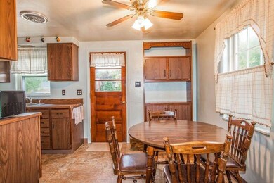 The Dining Room features a ceiling fan and furnitu