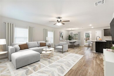 Virtually staged den area & dining area.