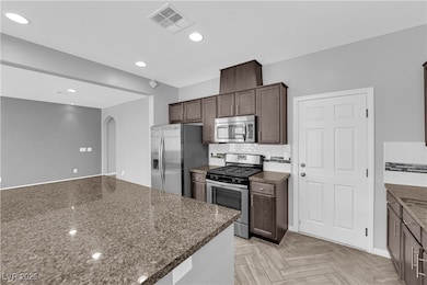 Kitchen featuring appliances with stainless steel