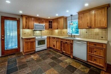 NEWER DOOR ACCESSING WRAP AROUND DECK, BACKSPLASH 