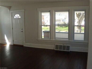 Living room with refinished hardwood floor.