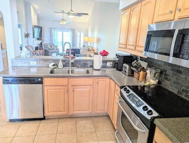 Kitchen with appliances with stainless steel finis