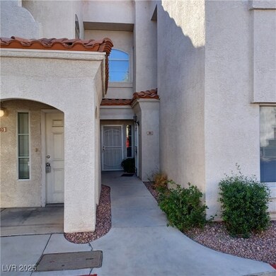 Entrance to property featuring stucco siding and a