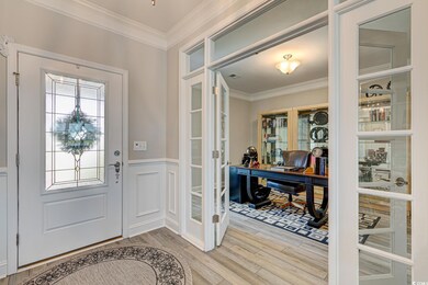 Foyer entrance with french doors, light wood-type 