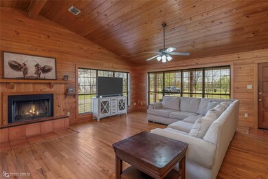 Living room with vaulted ceiling, plenty of natura