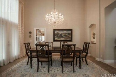 Beautiful formal dining room located off the gourmet kitchen.  French doors invite you outdoors and makes the natural flow of this home so warm, welcoming and perfect. 
