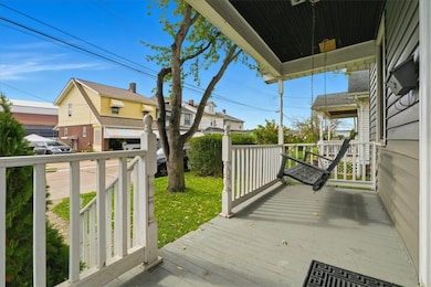 Front porch with swing to enjoy your morning coffee.