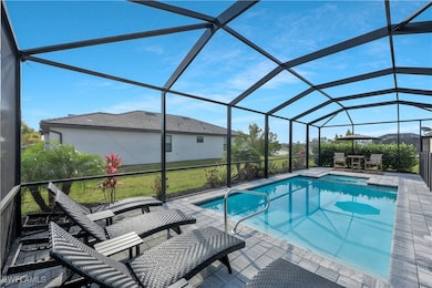View of pool featuring a pool with connected hot t