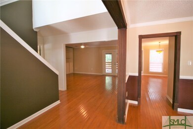 Walk in to a spacious foyer with two story ceiling