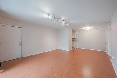 Living room has ample space for a sectional sofa a