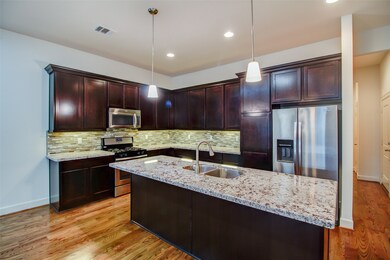 Large granite countertops make the island a great