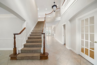 This photo features a spacious, light-filled entry