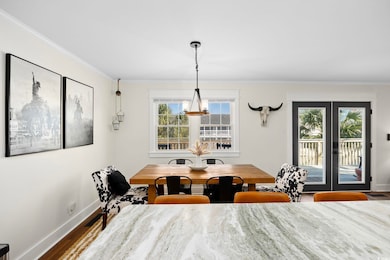 Dining space featuring ornamental molding, french 