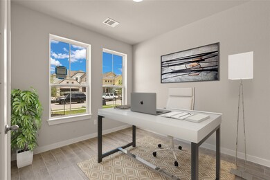 Quietly nestled in front of the home is the handsome home office. Featuring gorgeous flooring, custom paint and large windows.