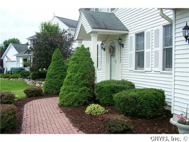 Exterior Front Great landscaping with brick walkwa