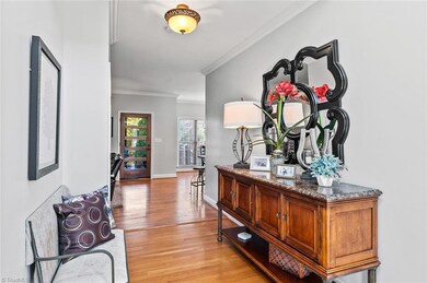 View from the 2 story foyer that looks into the den/family room area.  Door shown leads to the inviting screen porch.