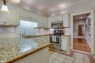 Great kitchen with granite counters, under counter lighting, and up lights.