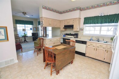 Just off the living room is the spacious kitchen t